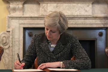 Theresa May signs Article 50 letter and calls for unity as 'momentous' Brexit process begins