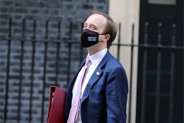 MPs vote to extend Covid powers as Hancock admits they may roll over into 2022