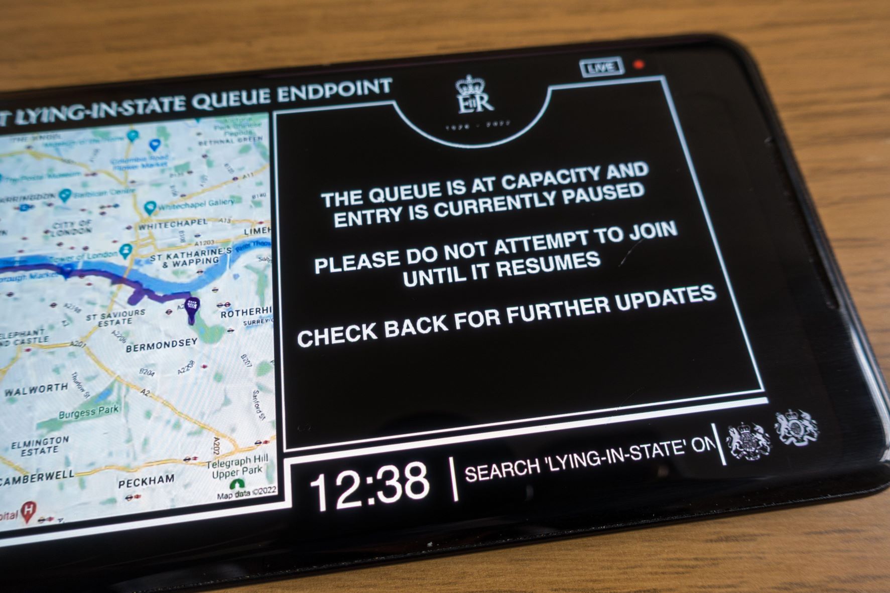 an iPad showing the Queue Tracker