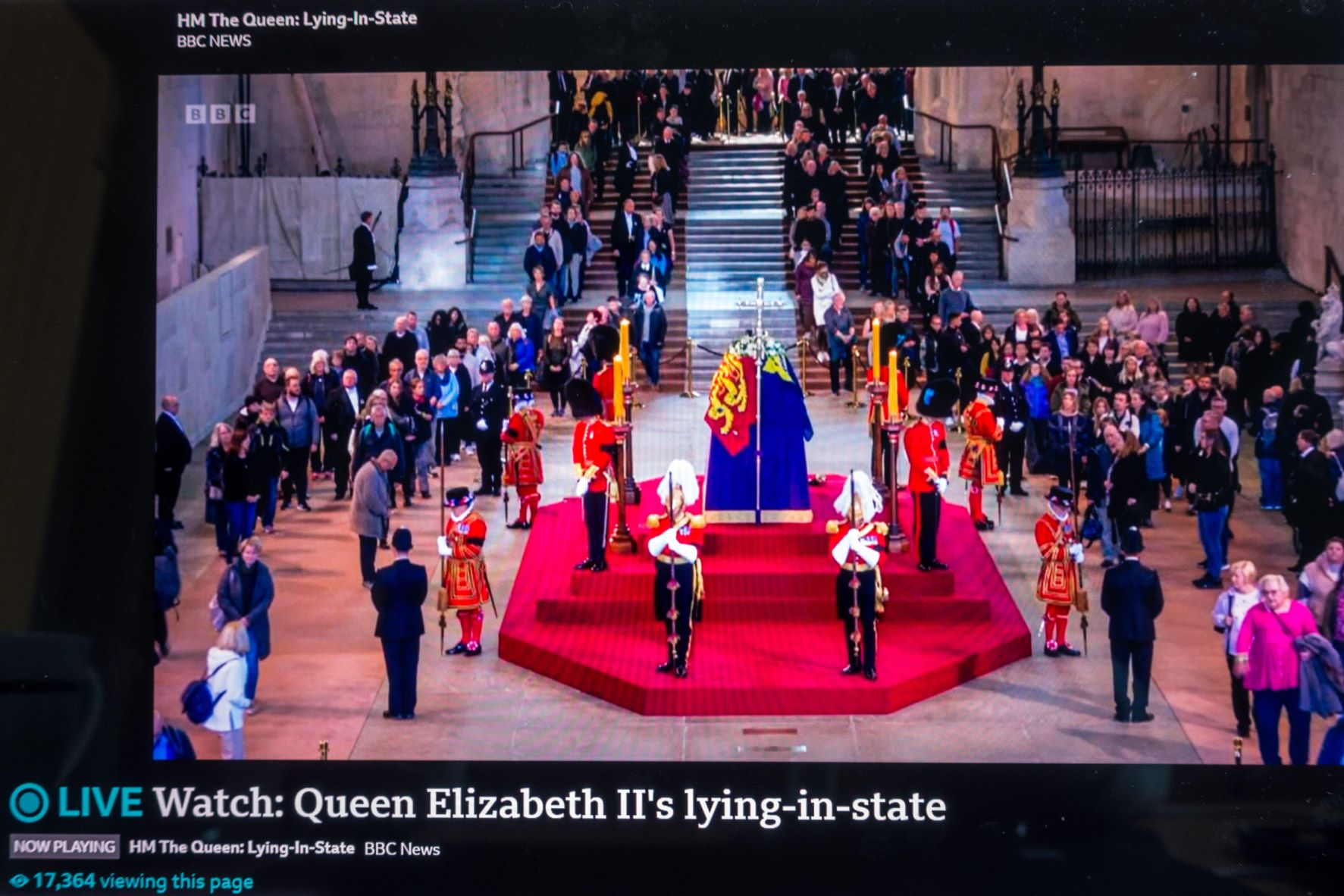 A TV screen showing BBC News coverage of the Queen's Lying-in-State