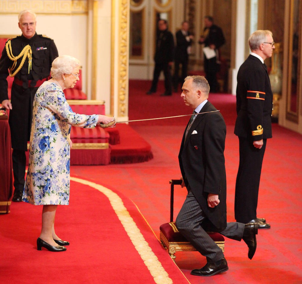 Mark Sedwill being knighted by the Queen