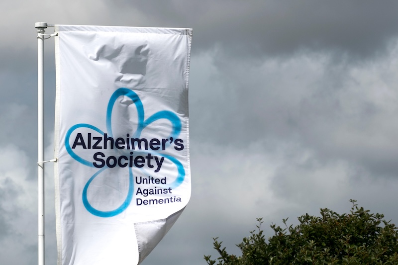 A banner for Alzheimers Society flapping in the wind